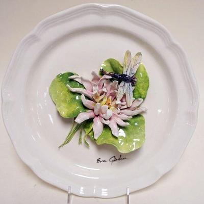 1023	EVA GORDON CERAMIC PLATE WITH APPLIED FLOWERS AND DRAGON FLY, APPROXIMATELY 12 IN
