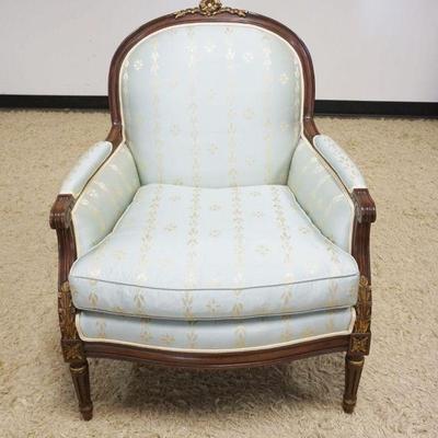 1089	UPHOLSTERED FRENCH PROVINCIAL ARM CHAIR WITH CARVING AND GILT WOOD FINISHED ACCENTS
