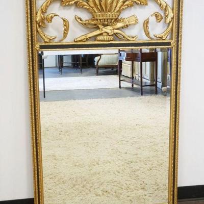 1083	FREIDMAN BROTHERS, OUTSTANDING GILT FRAMED HANGING BEVELED EDGE MIRROR WITH URN TOP AND SCROLLED 3 DIMENSIONAL VINE, APPROXIMATELY...