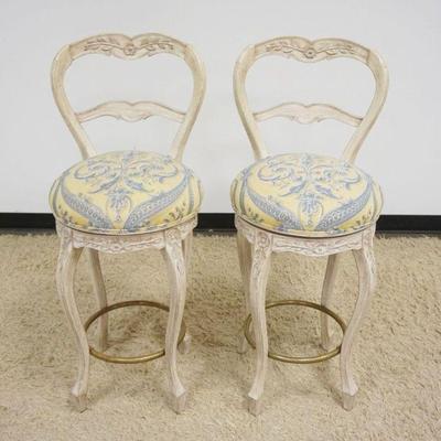 1137	PAIR OF CARVED WOOD BALLOON BACK SWIVEL BAR STOOLS WITH UPHOLSTERED SEATS, APPROXIMATELY 44 IN H
