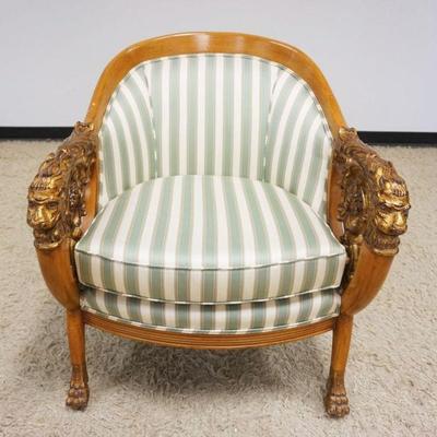 1148	NEO CLASSICAL UPHOLSTERED ARM CHAIR WITH HEAVILY CARVED CURVED ARM, LION HEADS AND PAW FEET, APPROXIMATELY 28 IN X 42 IN X 34 IN H
