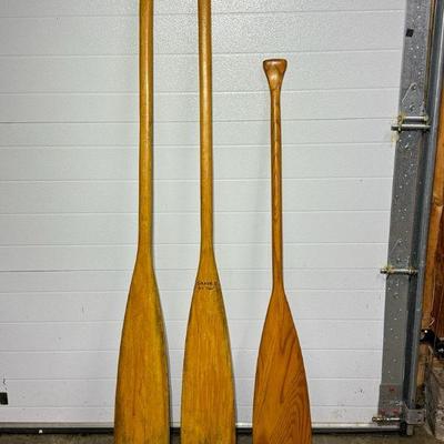 Three wooden oars
