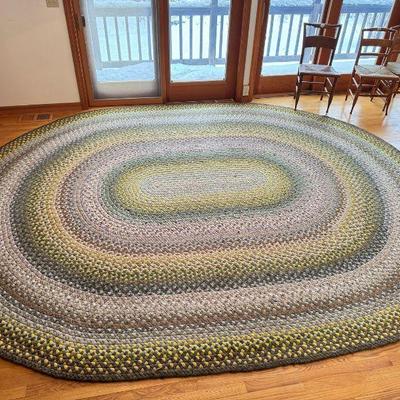 100% wool braided rug in greens and grays
