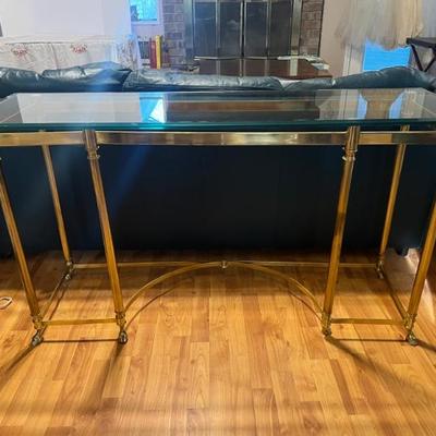 Glass top Brass Table. $150. 56x30x18. All items available for pre-sale with pre-sale shopping appointments. Please text 985 507-6684 to...