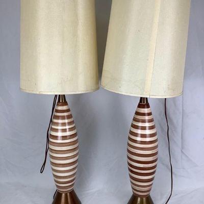REEM813 1960s Striped Lamps	Pair of 1960s lamps with a ceramic body body glazed in a stripe pattern, and a metal base and light fitting....