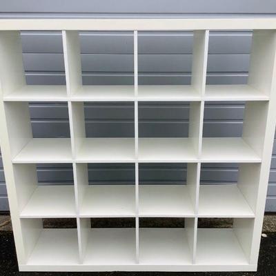 TRCR805 White Cubby Shelving	White shelving, squared for cubbies. Some dings and paint spots.Â Measures approximately 59" wide by...