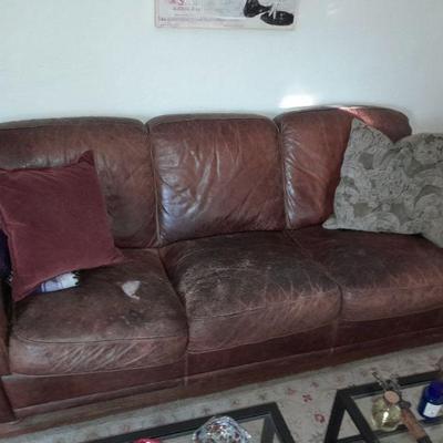 Man cave leather sofa - patch it priced