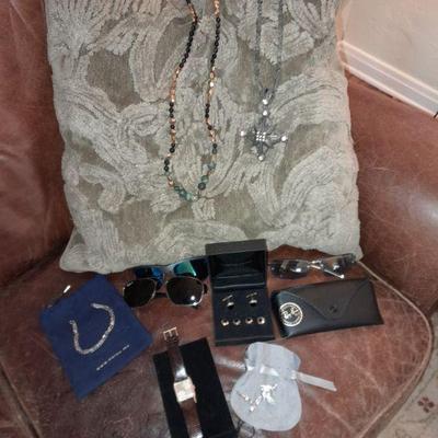 Assorted jewelry and Ray Ban shades