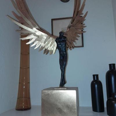 Avian Man cast iron sculpture with bronze finish and gold leaf