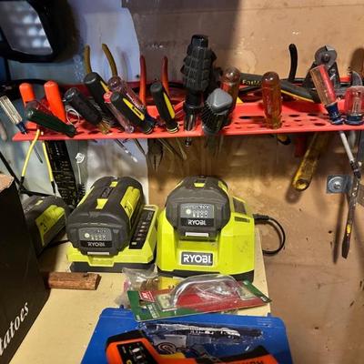 Garage full of tools including Ryobi, Black & Decker, etc