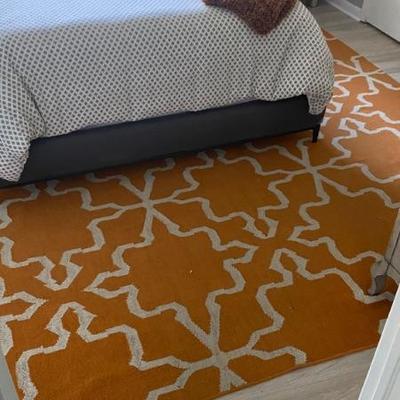 Orange area rug 141 x 114