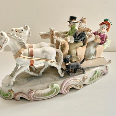Antique porcelain Christmas holiday sleighing group