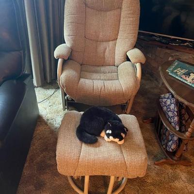 Swivel rocking gliding metal chair and ottoman. 