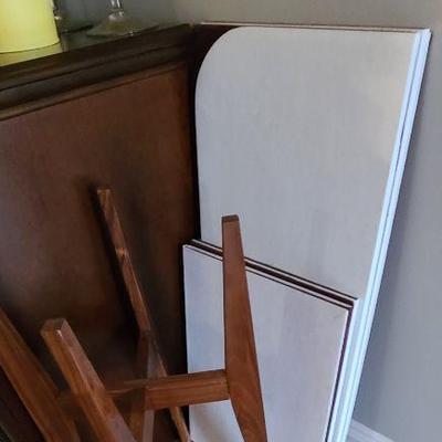 A wooden plant Stand and Pads for a dining table