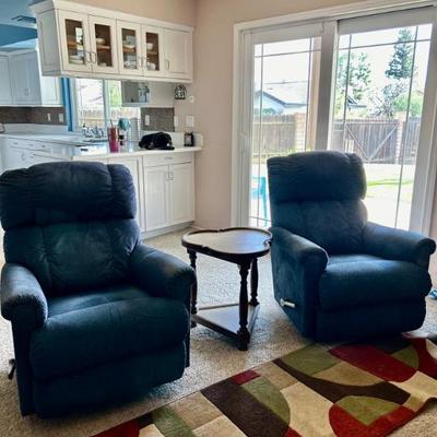 Two blue reclining chairs