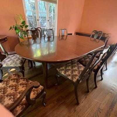 Large circular table 60"D extends to 120" 10 chairs available. With pads.