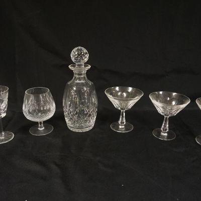1074	WATERFORD CRYSTAL 10 1/2 IN H DECANTER AND GROUP OF ASSORTED STEMWARE
