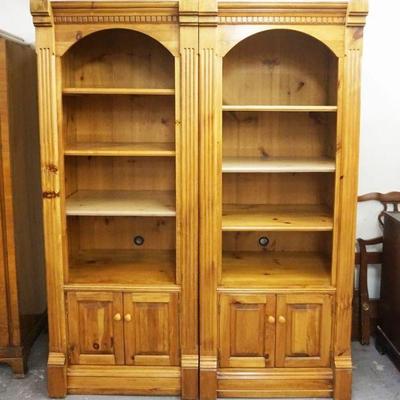 1153	PAIR OF PINE REEDED COLUMN BOOKCASES HAVING 3 ADJUSTABLE SHELVES OVER DOUBE DOORS AT BASE, APPROXIMATELY 31 IN X 24 IN X 80 IN H EACH

