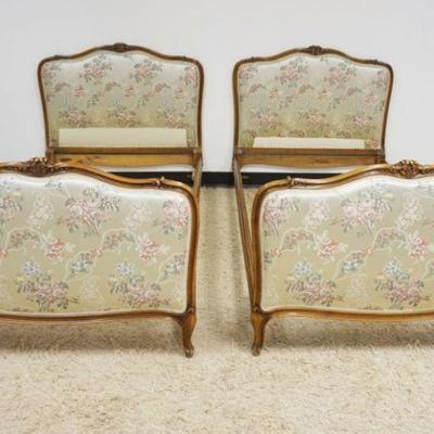 1165	PAIR OF FLORAL UPHOLSTERED FRENCH PROVINCIAL SINGLE BEDS WITH CARVED FRUITWOOD FRAMES
