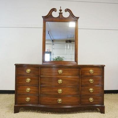 1136	DIXIE MAHOGANY 12 DRAWER SERPENTINE CHEST WITH MIRROR, APPROXIMATELY 60 IN X 19 IN X 79 IN

