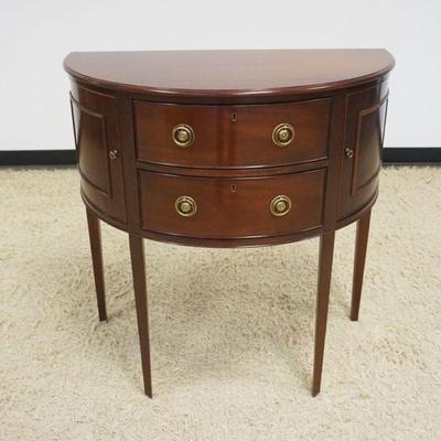 1139	BAKER HISTORICAL CHARLESTOWN MAHOGANY 2 DOOR, 2 DRAWER DEMILUNE SERVER, APPROXIMATELY 34 IN X 18 IN X 35 IN H
