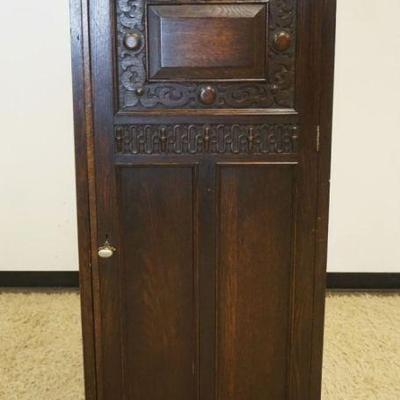 1132	GERMAN CARVED 1 DOOR NARROW WARDROBE WITH PANELED SIDES, APPROXIMATELY 28 IN X 21 IN X 66 IN H
