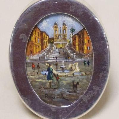 1257	MINIATURE OVAL PAINTING IN OVAL FRAME ON SHEET OF SILVER DEPICTING A STREET SCENE, ARTIST SIGNED, APPROXIMATELY 1 1/2 IN X 2 IN...