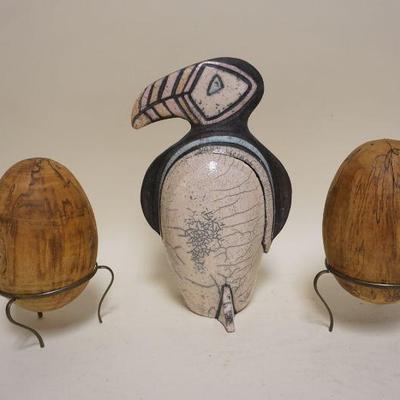 1065	ART POTTERY 2 PIECE TOUCAN AND 2 WOOD EGGS ON STANDS, TOUCAN APPROXIMATELY 12 1/2 IN H
