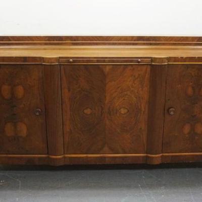 1129	CONTINENTAL WALNUT SIDEBOARD WITH 3 DOORS AND CENTER PULL OUT INSET MARBLE CUTTING BOARD, APPROXIMATELY 91 IN X 27 IN X 48 IN H
