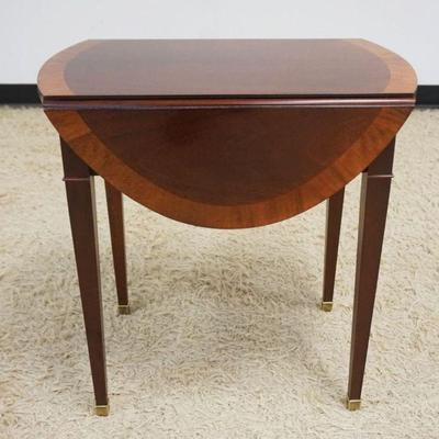 1143	BAKER BANDED MAHOGANY DROP LEAF  OCCASIONAL TABLE WITH 1 DRAWER, APPROXIMATELY 16 IN X 25 IN X 25 IN H, 2- 8 IN DROP LEAVES
