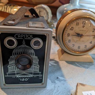 Antique camera & vintage alarm clock 