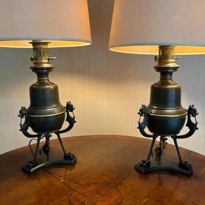 Pair of antique metal lamps, footed with dragons