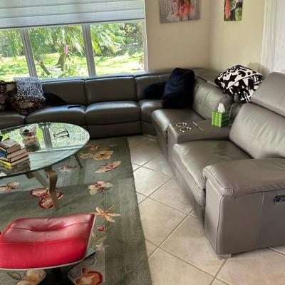 gray leather couch with three recliners $3500 original price$ 10,000