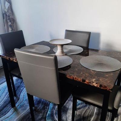 Dining table and 4 chairs. $100.00