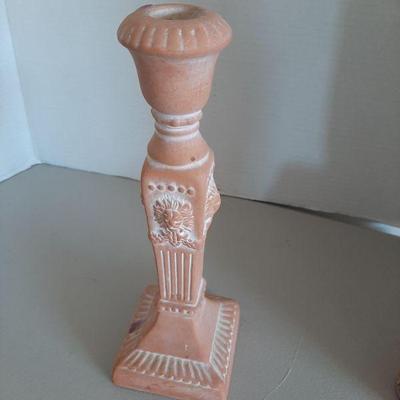 Terracotta candlestick with lions heads. $5
