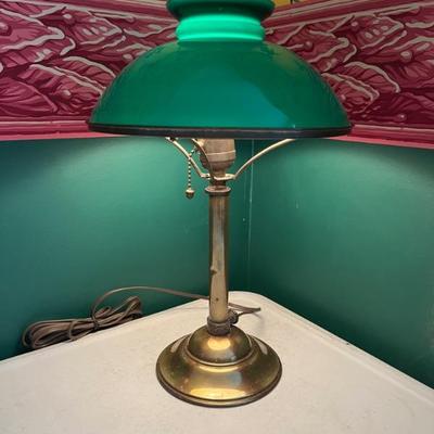 A large selection of antique green case glass lamps and shades, including Handel basesâ€”floor lamps, desk lamps, table lamps