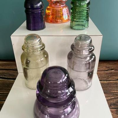Antique glass electric insulators: lots of colors: carnival glass, marigold, milk glass, black, blue, cobalt, turquoise, amber, green,...