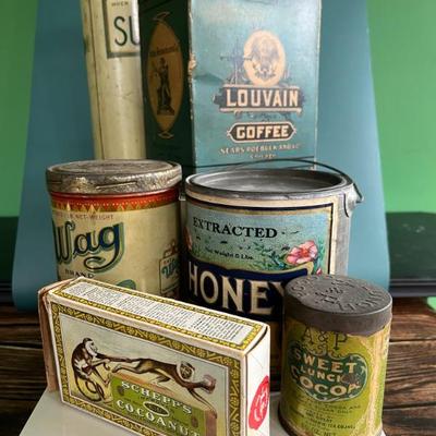 Antique advertising tins and cardboard containers: G&P bread, McLaughlin Coffee, Quaker, CR Tartar, Wag Coffee, Scheppâ€™s Cocoanut, A&P...