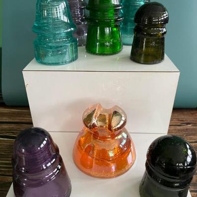 Antique glass electric insulators: lots of colors: carnival glass, marigold, milk glass, black, blue, cobalt, turquoise, amber, green,...