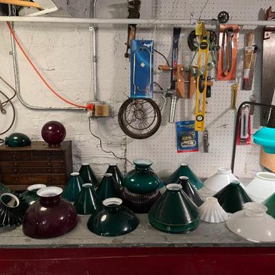 Lots of antique case glass lamp shades in green, milk glass, and red. Do you have an old lamp that needs a period replacement shade?