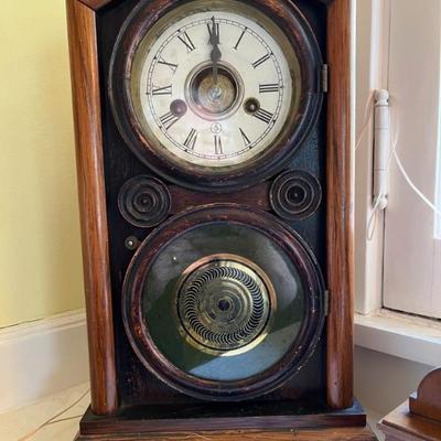 Lots of antique clocksâ€”mantel clocks, grandmother clocks and wall clocks