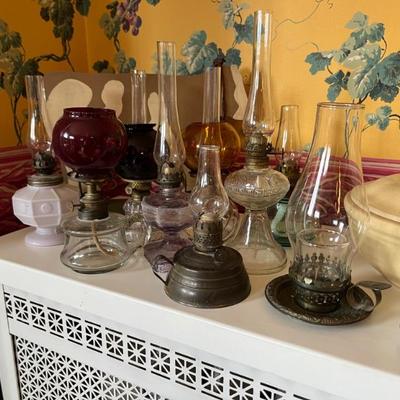 Antique oil lamps, lots of different sizes, from minis to large
