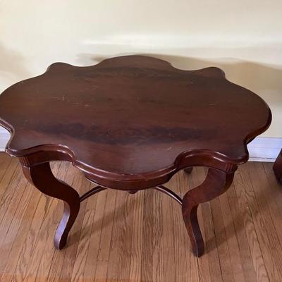 very pretty mahogany table with scalloped oval top, cabriole legs, cross supports with finial 