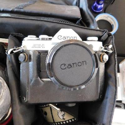 Canon AE1 with auto winder, telephoto lens, flash and case.