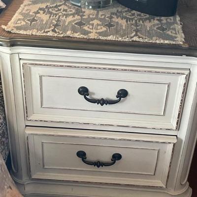  5 piece white distressed Bedroom set. No headboard. Includes dresser with mirror measures 64 x 19 x 40“ . Tall dresser with lift top...