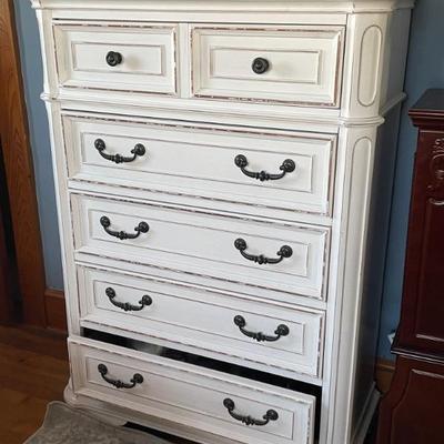  5 piece white distressed Bedroom set. No headboard. Includes dresser with mirror measures 64 x 19 x 40“ . Tall dresser with lift top...