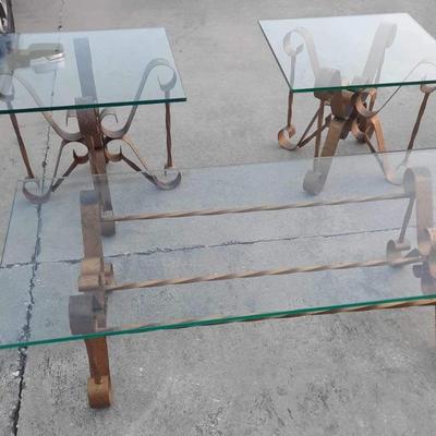 3 Matching Tables. Metal bottoms/glass tops. Can be sold separately. From front to back... Rectangle Coffee table $150. 2 Side Tables....