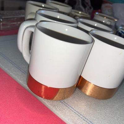 Set of 4 white cups with gold bottoms. $12