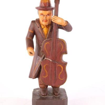 Carved wooden bass player
