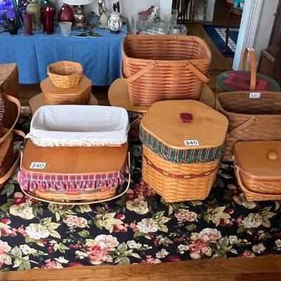 Multiple Longaberger baskets of various shapes and sizes